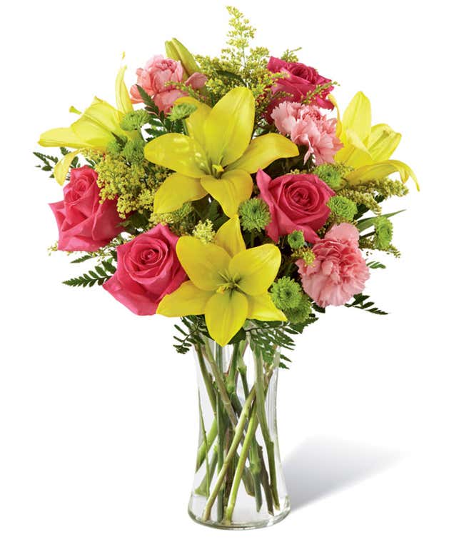 Tall arrangement with pink roses, yellow lilies in a tall cylinder vase