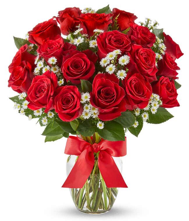 18 Red Roses and Monte Casino Flowers in a Clear Glass Vase with a red bow