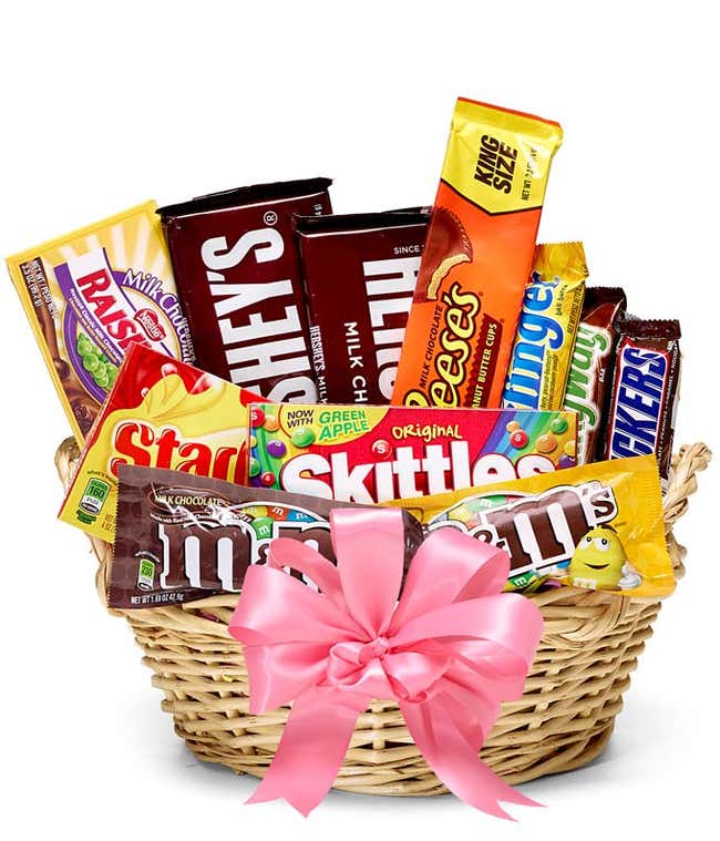 Candy delivered in a basket with a pink bow