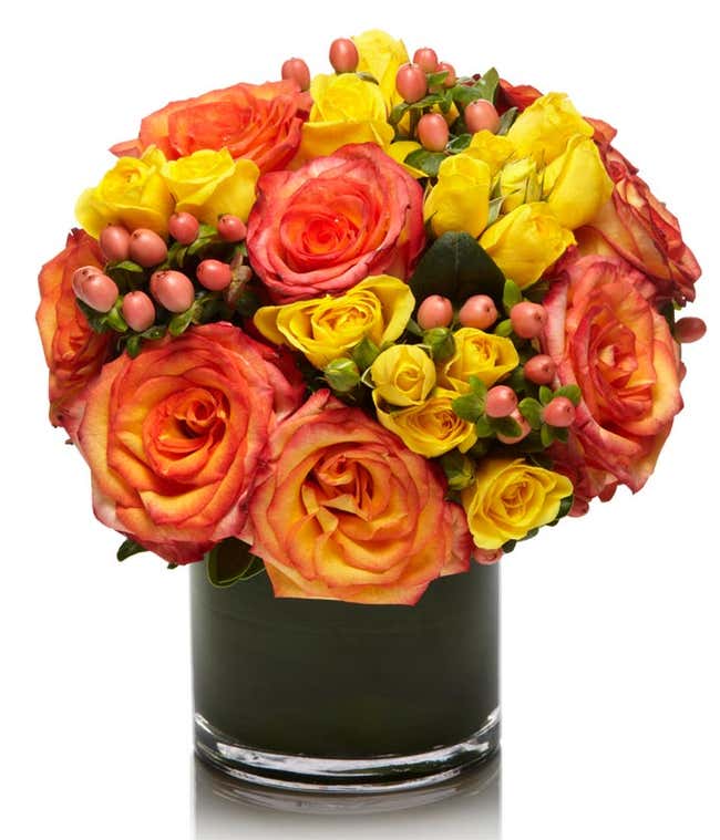 Peach Roses and Yellow Spray Roses in round vase