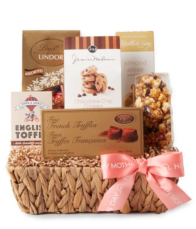 A Mother's Day gift basket filled with decadent treats including Dark Chocolate Rum Pecan English Toffee, Almond Anise Mini Biscotti, Chocolate French Truffles, Lindt Lindor Assorted Truffles, Chocolate Chip Cookies, and Chocolate Caramel Corn, presented 