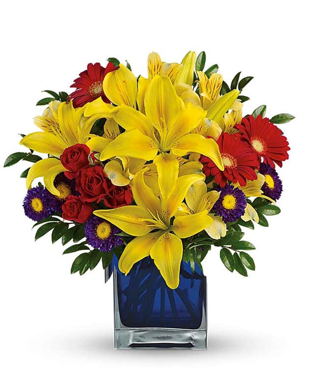 Yellow lilies, red flowers and purple asters bouquet