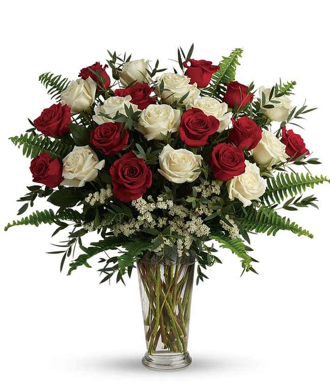 White roses and red roses in a sophisticated bouquet