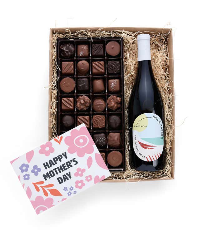 A gift box with Hill &amp; Harbor Pinot Noir and a 1 lb. box of assorted artisan chocolates with a 'Happy Mother's Day' card placed on top.