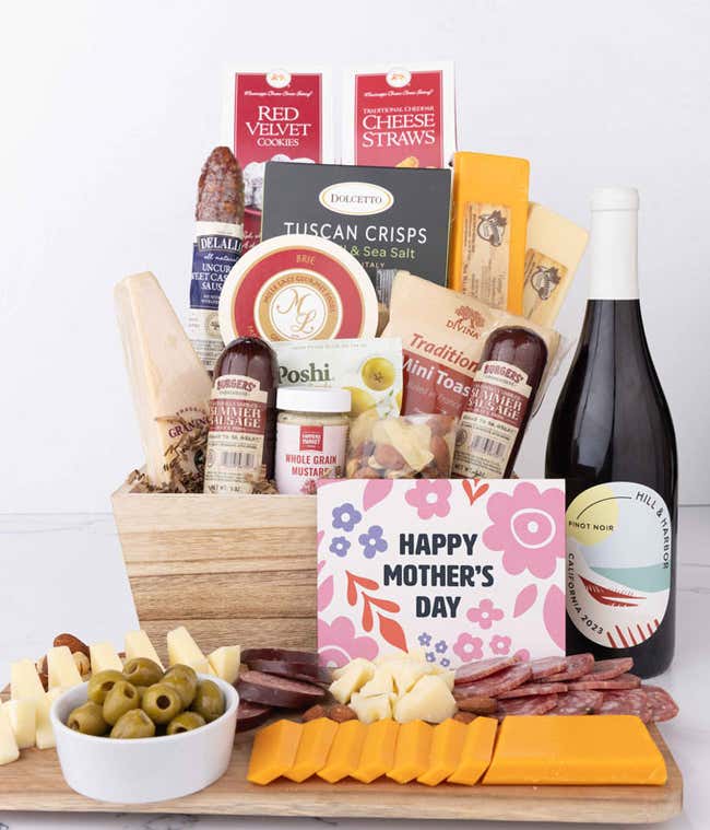 Mother&rsquo;s Day charcuterie crate with Hill &amp; Harbor Pinot Noir, artisan sausage, cheeses, olives, Tuscan crisps, mustard, cookies, and savory snacks displayed with sliced meats, cheeses, and a floral Mother&rsquo;s Day card.