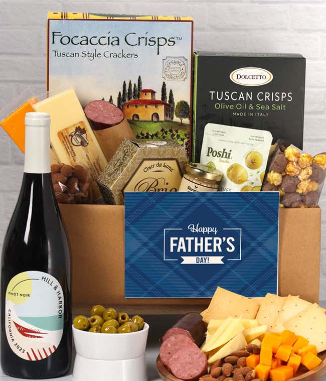 A bottle of Hill &amp; Harbor Pinot Noir with charcuterie, including Tuscan crisps, focaccia crackers, brie, mustard, sausage, 3 cheeses, olives, smoked almonds, and chocolate-covered treats, complete with a 'Happy Father's Day' card.