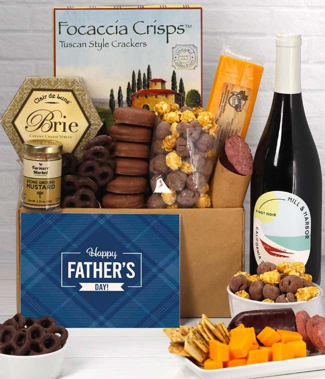 A bottle of Hill &amp; Harbor Pinot Noir with focaccia crisps, 2 cheeses, mustard, sausage, chocolate-covered pretzels, caramel popcorn, and chocolate-covered Oreos, complete with a 'Happy Father's Day' card.