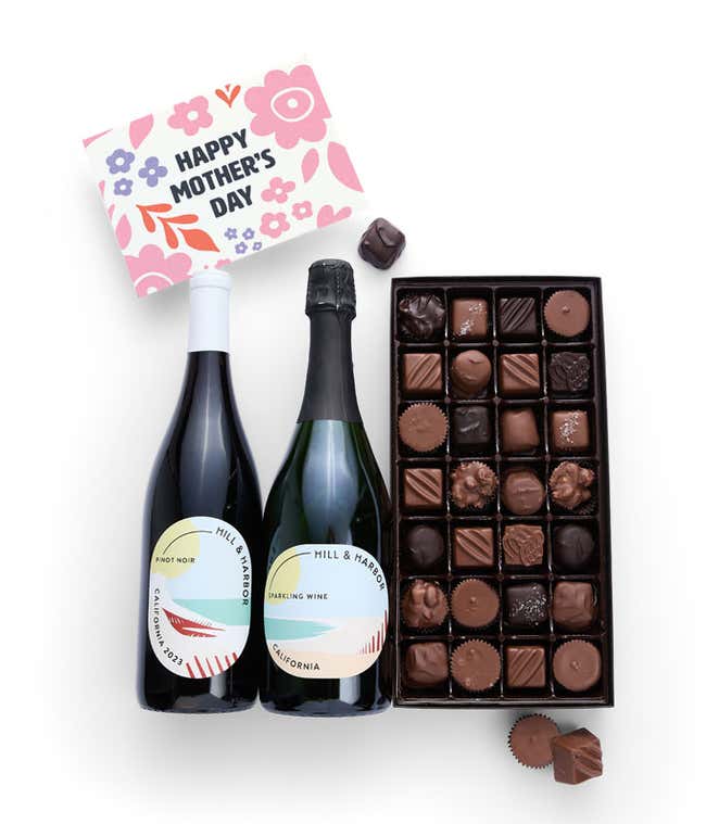 Bottles of Hill &amp; Harbor Pinot Noir and Sparkling wine sit alongside a 1 lb. box of assorted chocolates and a 'Happy Mother's Day' card.