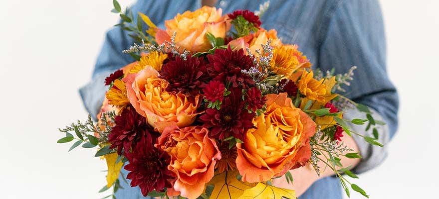 Florist designing a summer floral arrangement